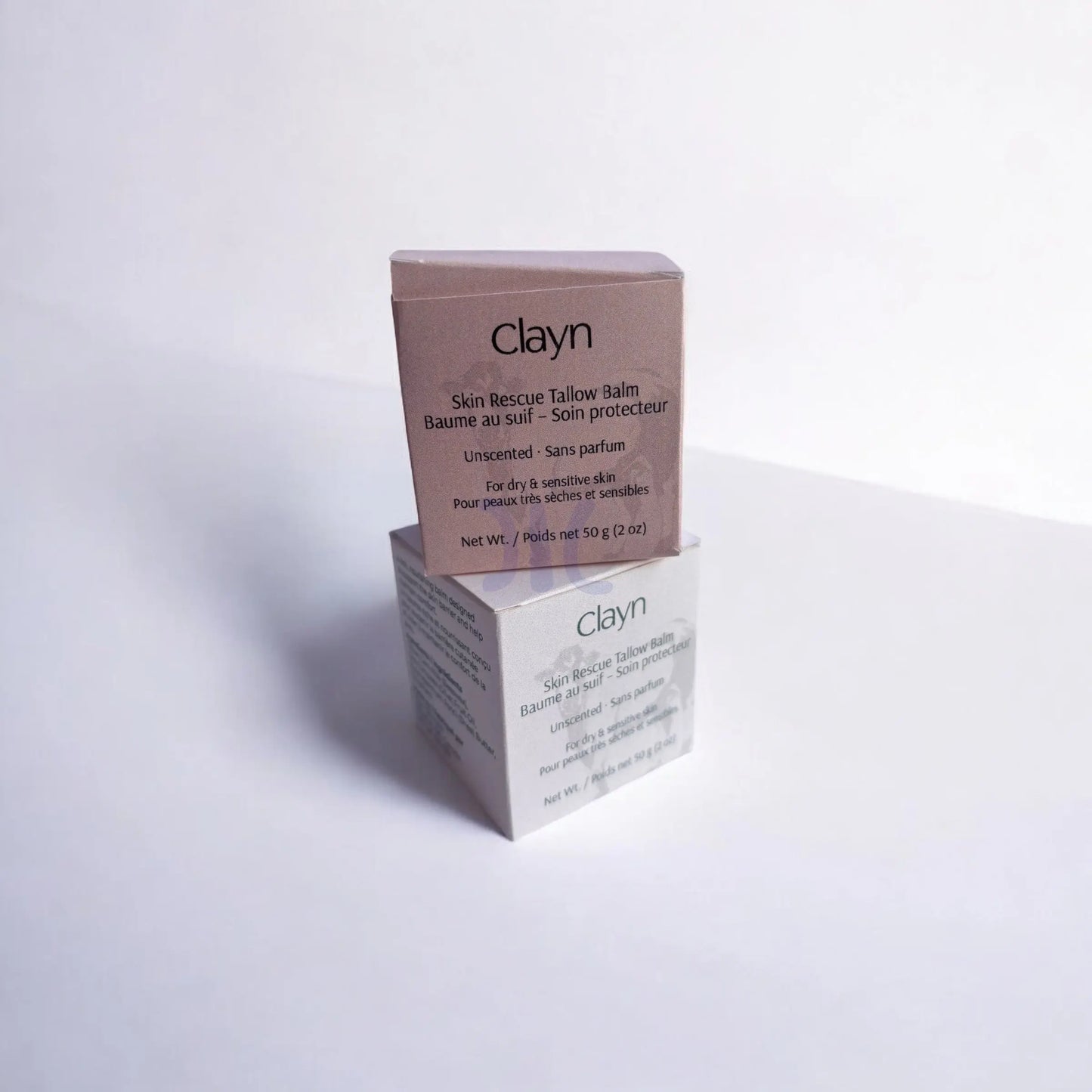 Two boxes of Clayn skin balm on a white background
