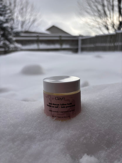 Jar of Claryn product in the snow with a blurred background