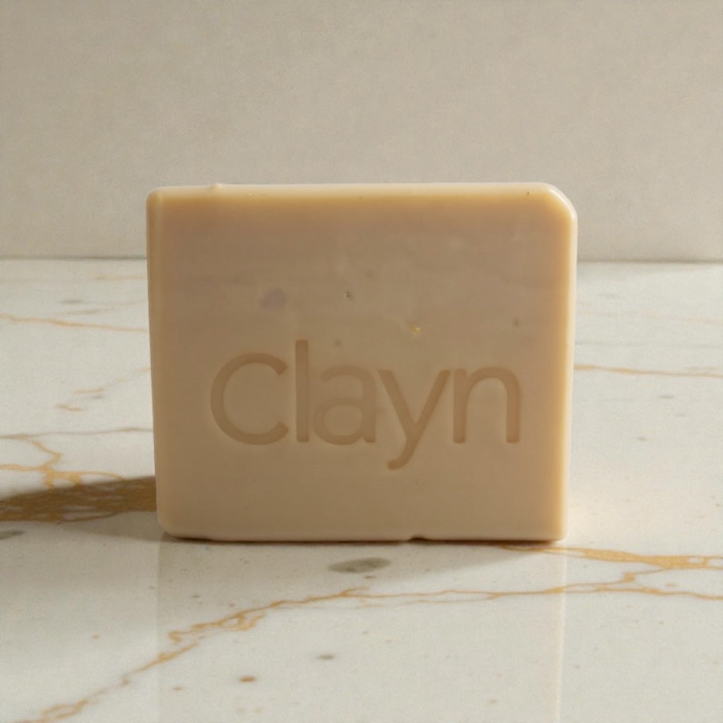Bar of soap with 'clayn' branding on a marble surface