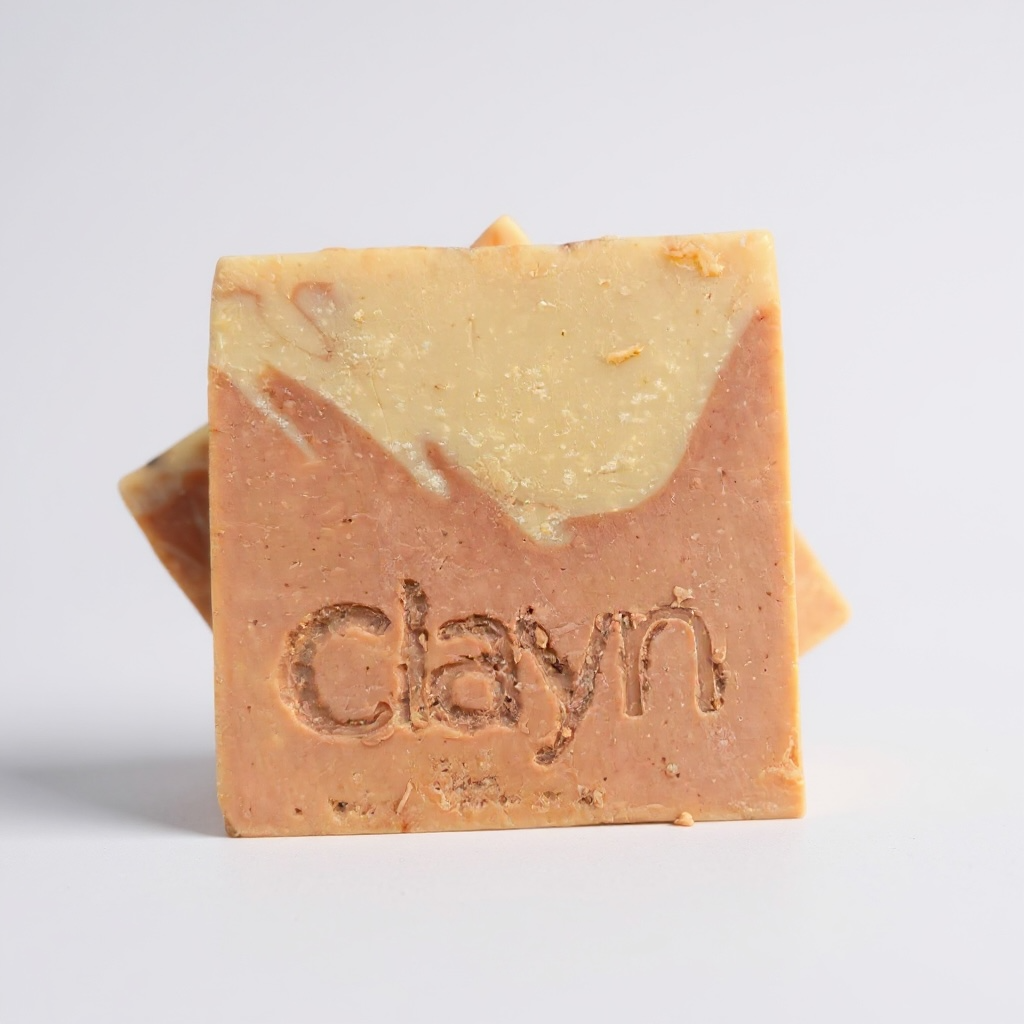 Bar of soap with 'clayn' branding on a light gray background