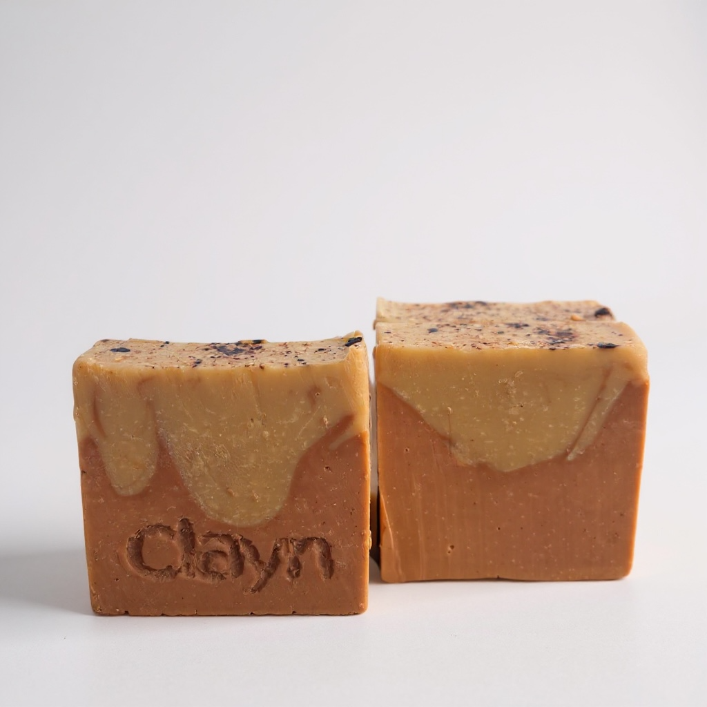 Two bars of soap with 'Clayn' branding on a light gray background