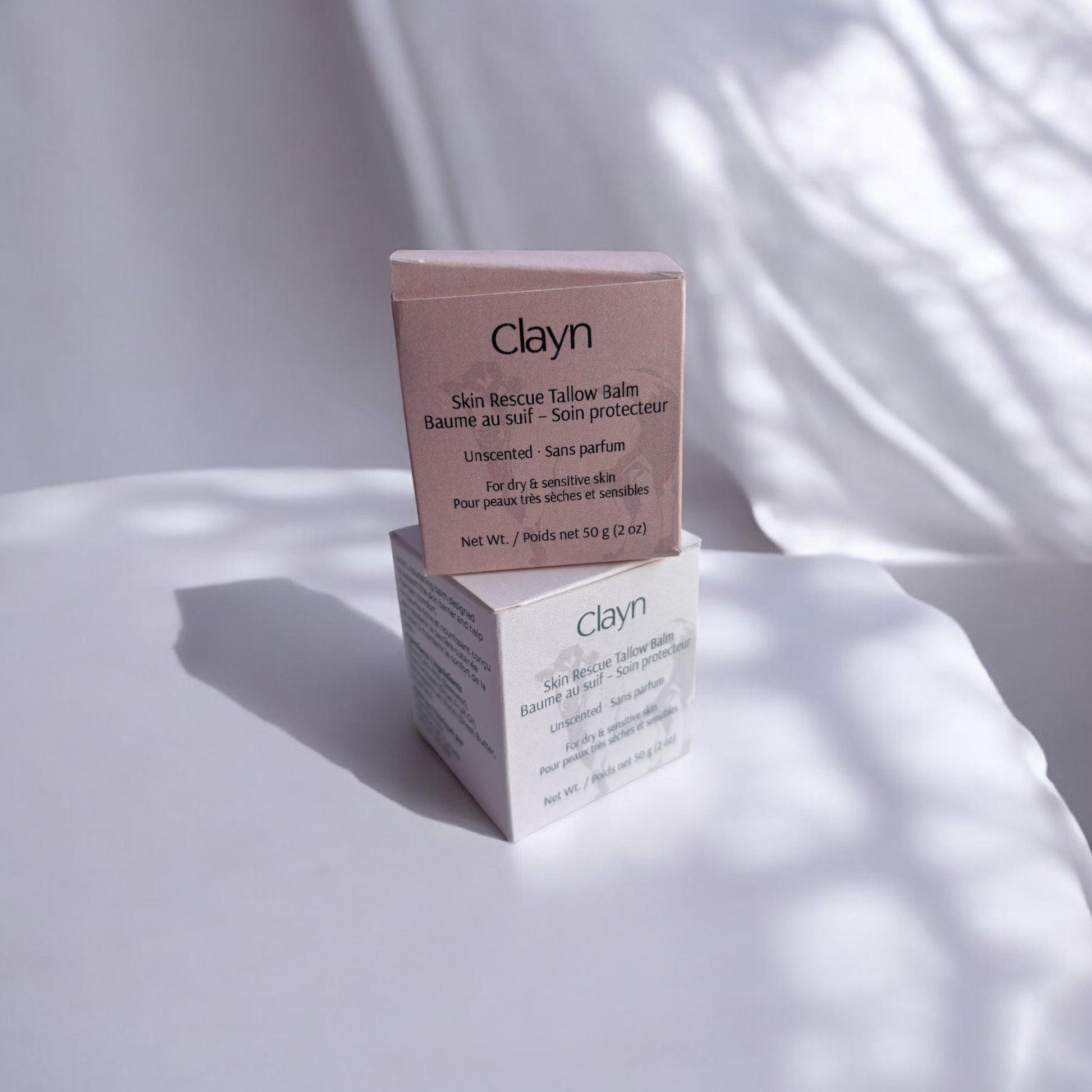 Clayn repair tallow balm packaging on a white surface with soft shadows
