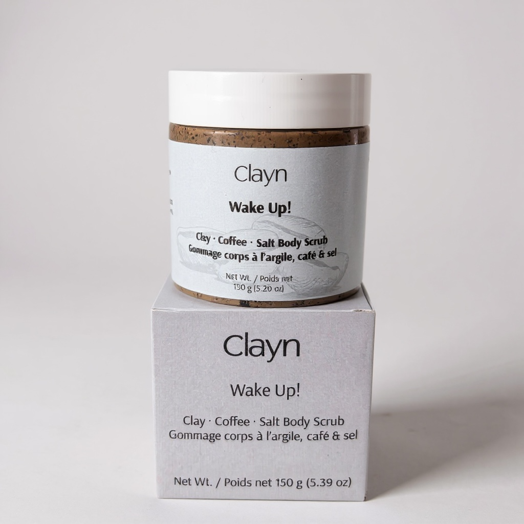 Clayn Wake Up! Clay Coffee Salt Body Scrub container and packaging on a light gray background
